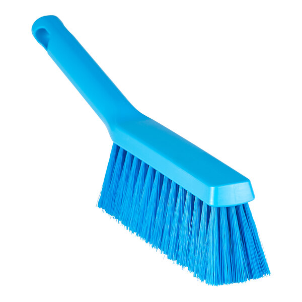 A blue brush with long bristles and a handle.