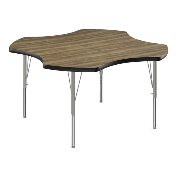 A rectangular Correll activity table with a wood surface and black edge and silver metal legs.