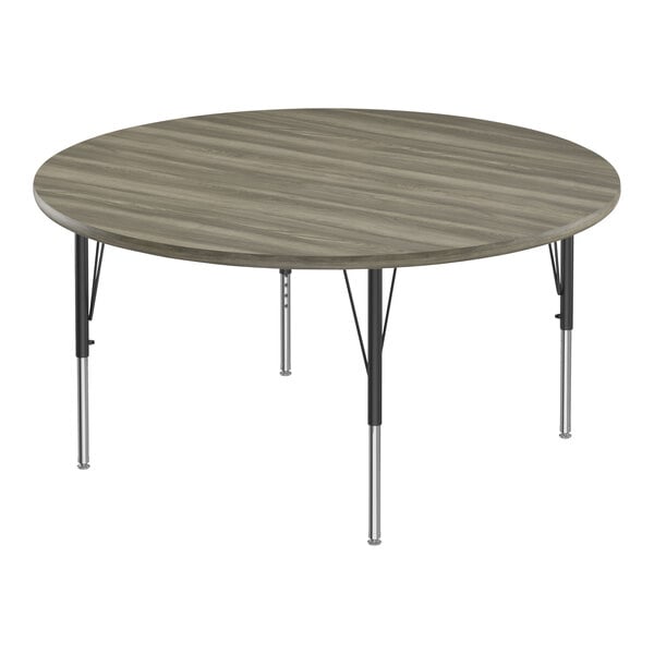 Correll Deluxe 60″ Round New England Driftwood 19″-29″ Adjustable Height High-Pressure Laminate Top Activity Table with Black Legs and Driftwood T-Mold