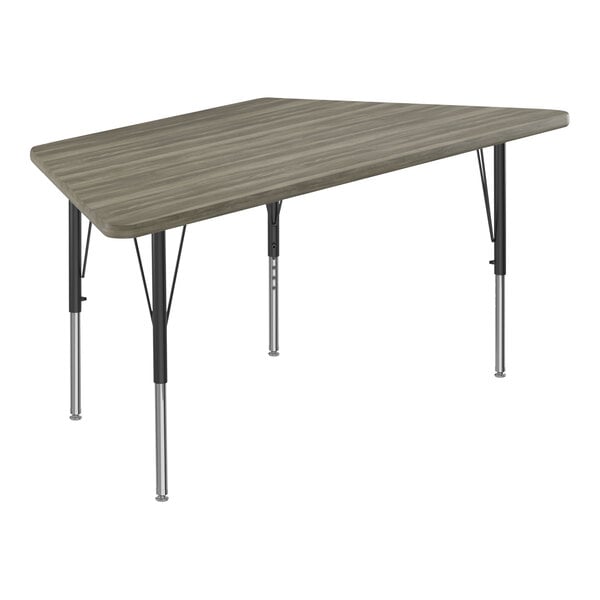 Correll Deluxe 30″ x 60″ Trapezoid New England Driftwood 19″-29″ Adjustable Height High-Pressure Laminate Top Activity Table with Black Legs and Driftwood T-Mold