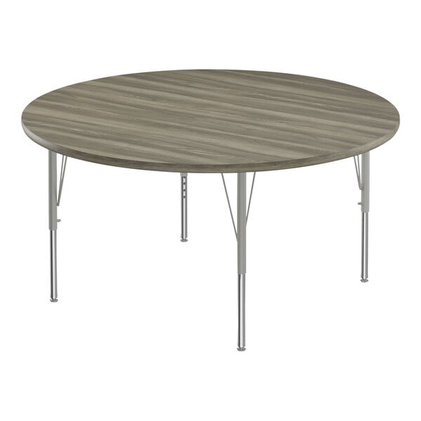 Correll Deluxe 48″ Round New England Driftwood 19″-29″ Adjustable Height High-Pressure Laminate Top Activity Table with Silver Legs and Driftwood T-Mold