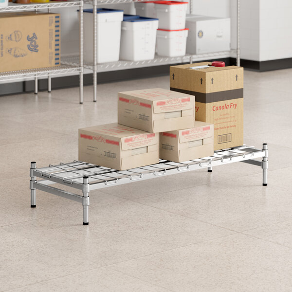 Regency Spec Line 18" x 48" x 8" NSF Stainless Steel Wire Stationary Dunnage Rack with Wire Mat and 3-Sided Frame