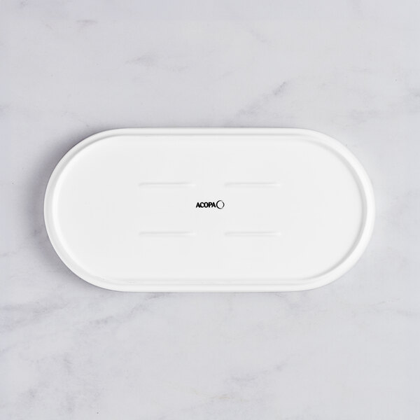 A white rectangular Acopa Lore porcelain platter with a raised rim.