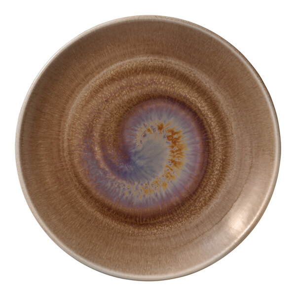A close up of a Heart & Soul white porcelain coupe plate with a blue and brown spiral design.