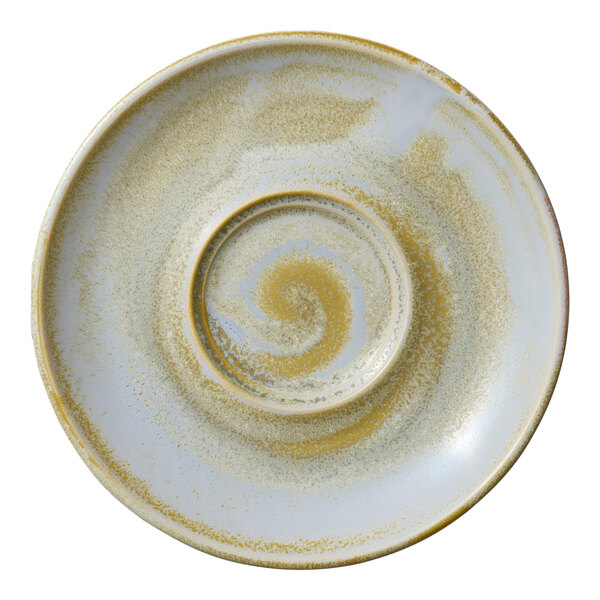 A close-up of a white Heart & Soul Breeze porcelain saucer with a yellow spiral pattern.