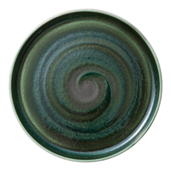 A white porcelain plate with a raised spiral rim in green and black.