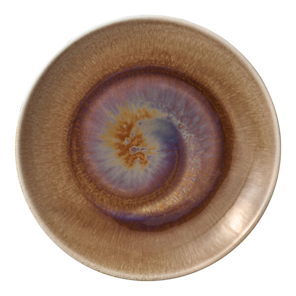 A white porcelain coupe plate with brown and blue swirls.