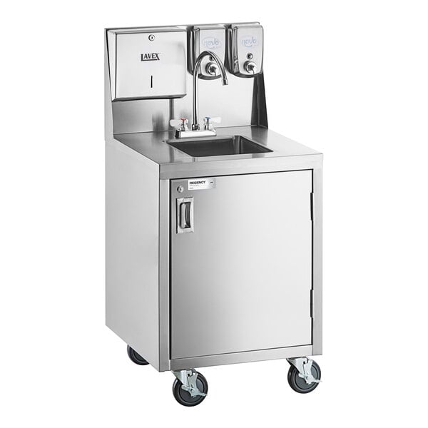 A stainless steel portable hand sink cart with a single bowl, gooseneck faucet, paper towel dispenser, soap dispensers, and four caster wheels.