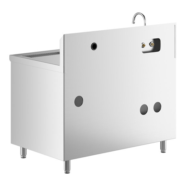 A stainless steel table with a left-side sink, a gooseneck faucet, and multiple circular cutouts on the back panel.