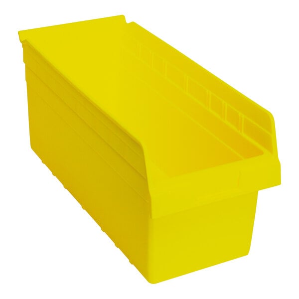 A yellow plastic Quantum shelf bin.