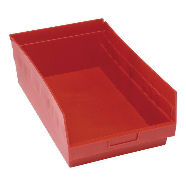 A red plastic Quantum shelf bin with a handle.