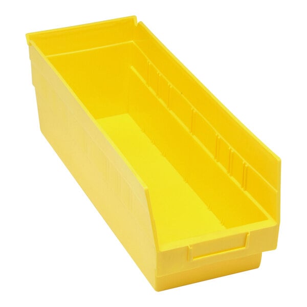 A yellow Quantum STORE-MORE plastic shelf bin with two compartments.