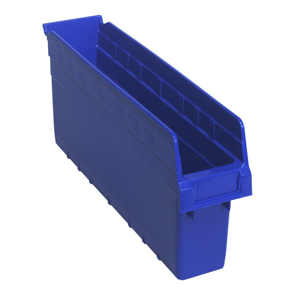 A blue plastic Quantum shelf bin with two compartments.