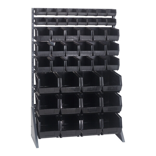 A gray steel rail rack with black bins on metal shelves.