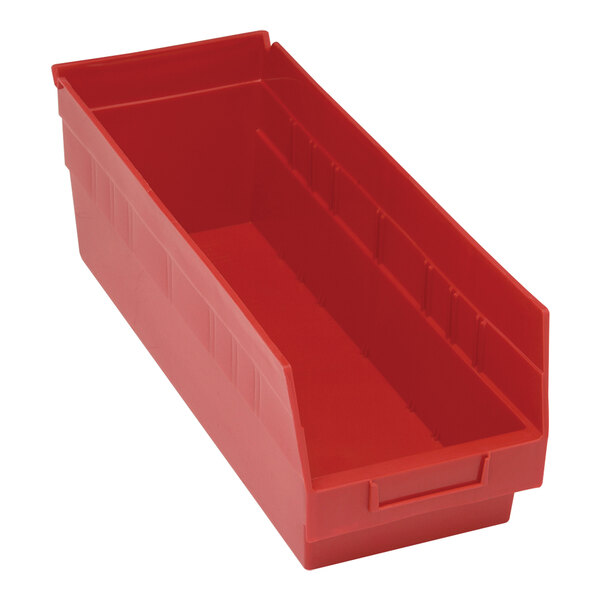 A close up of a red Quantum STORE-MORE plastic shelf bin with two compartments.