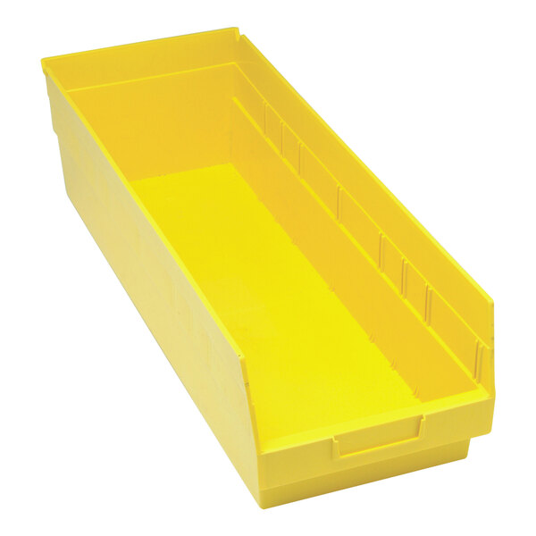 A yellow Quantum yellow plastic storage bin with a handle.
