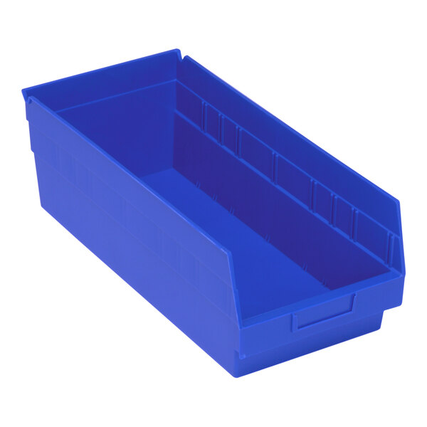 A close-up of a blue Quantum shelf bin with two compartments.