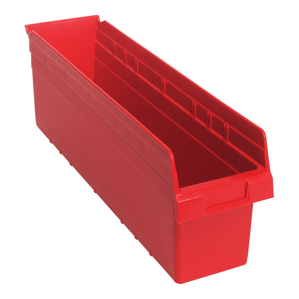 A red plastic Quantum shelf bin with two compartments.