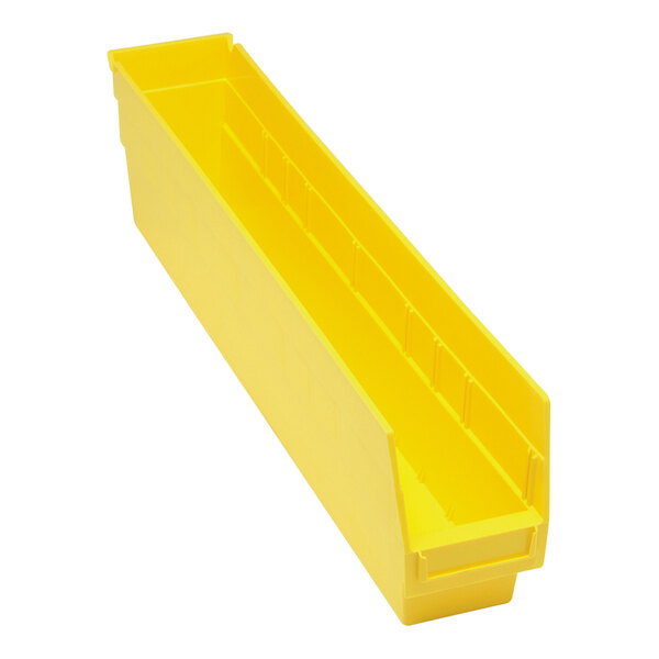 A yellow plastic Quantum shelf bin with two compartments.