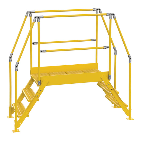 A yellow metal Vestil crossover ladder with metal bars.