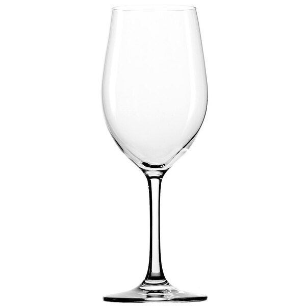 A close-up of a clear Stolzle Chardonnay wine glass with a stem.