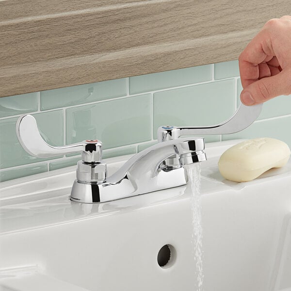 American Standard 5500175.002 Monterrey 0.5 GPM Deck-Mount Lavatory Faucet with 4" Centers, Cast Brass Spout, and Wrist Blade Handles