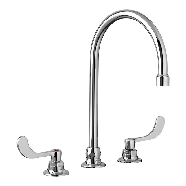 An American Standard deck-mount faucet with chrome wrist blade handles and a chrome finish.