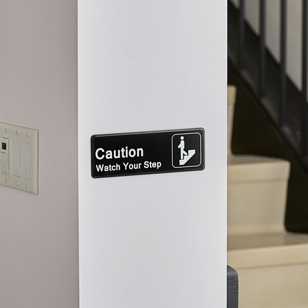 Lavex Caution, Watch Your Step Sign - Black and White, 9" x 3"