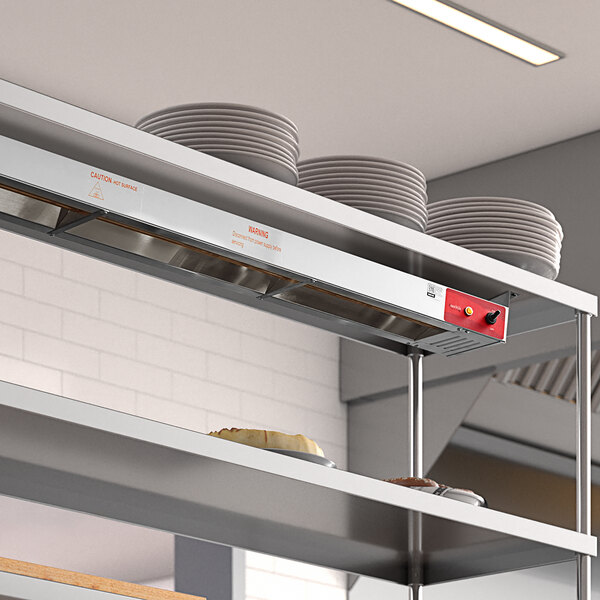 An Avantco stainless steel shelf with plates on it.