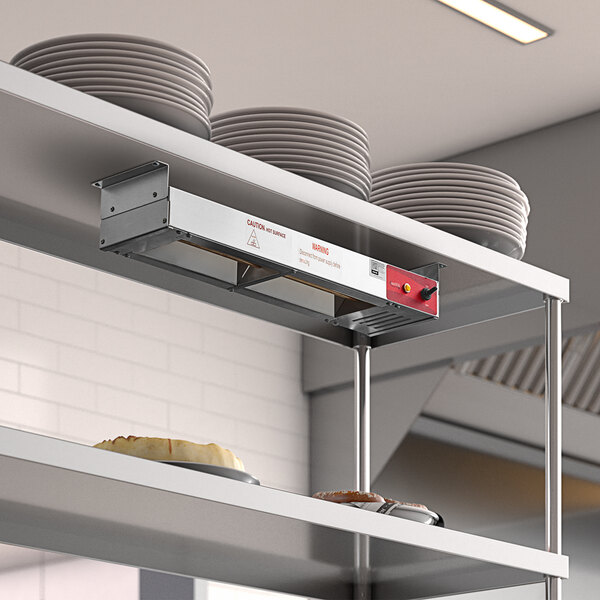 An Avantco strip warmer on a counter with plates on a shelf.