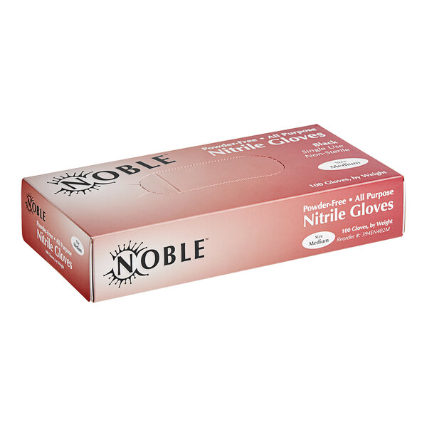 A pink box of Noble Products Nitrile gloves with black text on a counter.