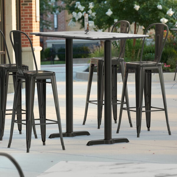 Lancaster Table & Seating Excalibur 27 1/2" x 47 3/16" Rectangular Smooth Versilla Bar Height Table with 4 Alloy Series Black Outdoor Cafe Barstools