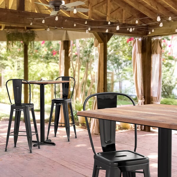 Lancaster Table & Seating Excalibur 27 1/2" x 27 1/2" Square Textured Yukon Oak Bar Height Table with 2 Alloy Series Black Outdoor Cafe Barstools