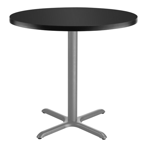 National Public Seating 30" Round Black Standard Height Cafe Table with Particleboard Core, X Base, and Gray Frame