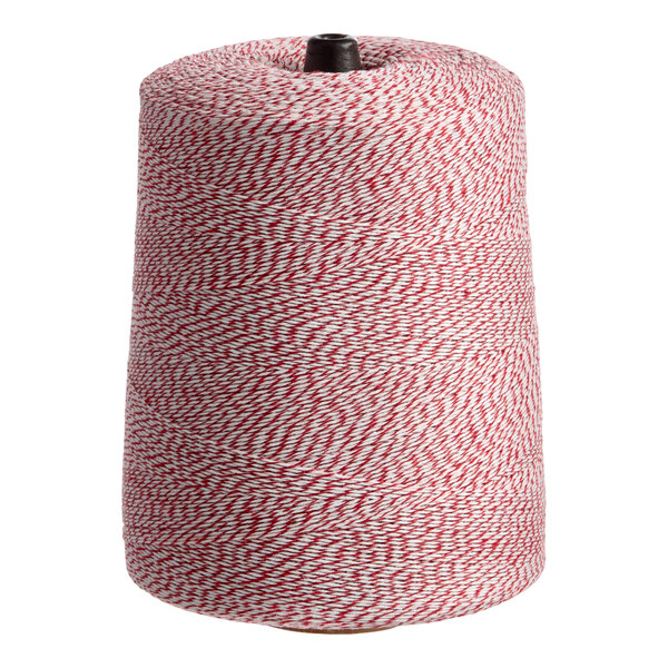 A large cone of red and white variegated polyester cotton blend baker's twine.