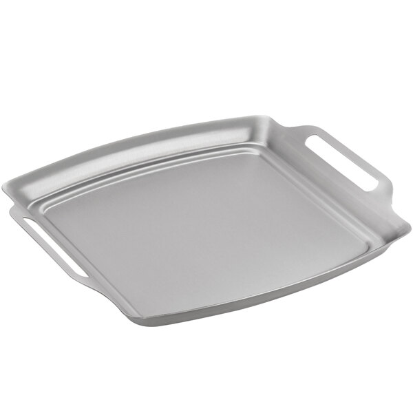A silver rectangular Vollrath griddle pan with two handles.