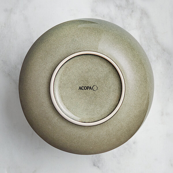 A heather gray Acopa Highlands china bowl with a white rim on a counter.
