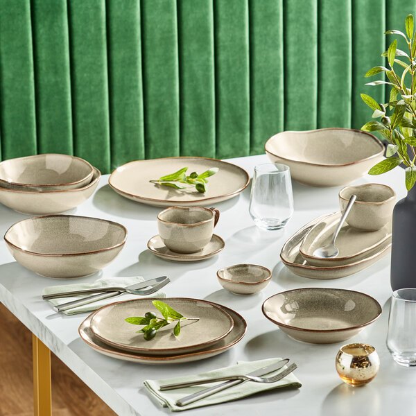 A table set with Acopa Highlands Heather Gray China bowls and plates.