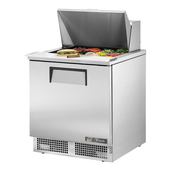 A True 1 Door Mega Top Refrigerated Sandwich Prep Table on a counter with food on top.