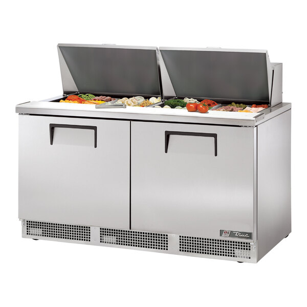A True 2 Door Mega Top Refrigerated Sandwich Prep Table with stainless steel food compartments.