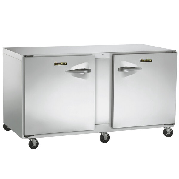 A large silver Traulsen undercounter refrigerator with left and right hinged doors.