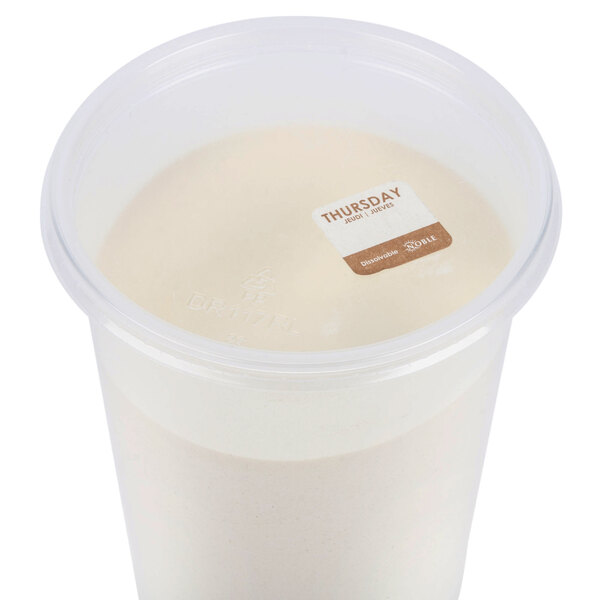 A plastic container with white Noble Products dissolvable food labels on it.