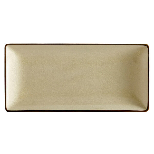 A CAC rectangular stoneware plate with white center and brown edges.