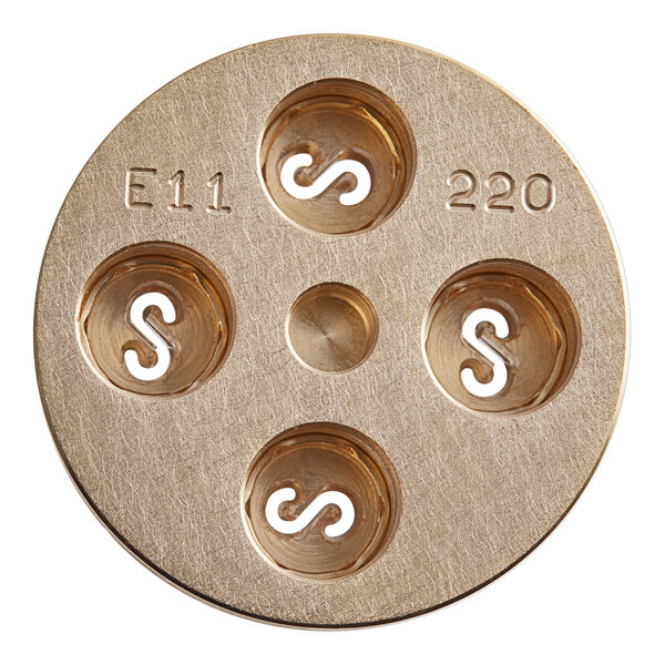 A circular brass Estella Casarecce pasta die with four holes.