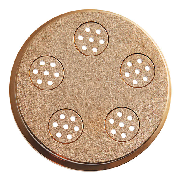 A circular metal pasta die with holes in it.