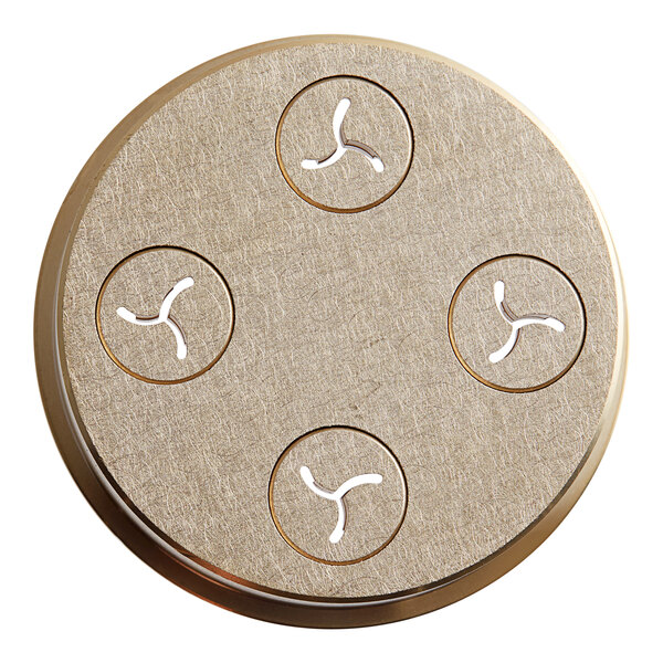 A round metal object with four circular holes.