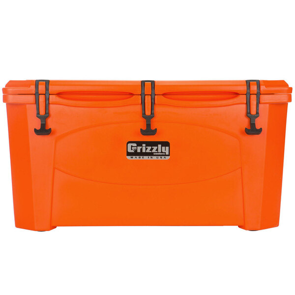An orange Grizzly cooler with black handles.