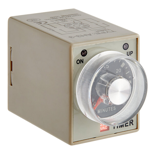 An Avantco grey timer box with a round dial.