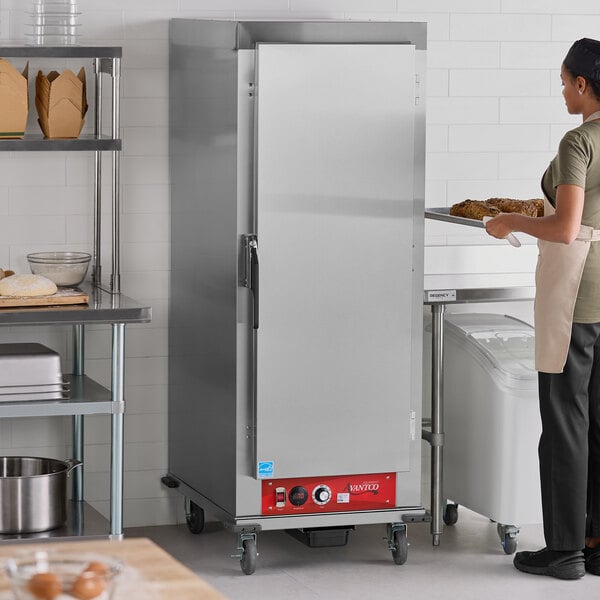 A full size insulated heated holding cabinet with a solid stainless steel door, designed for commercial kitchen use.