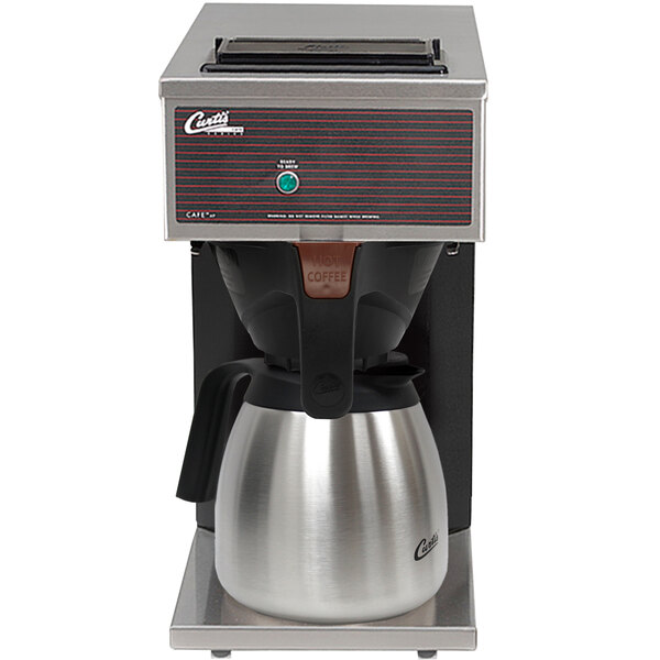 A Curtis pourover coffee brewer with a stainless steel thermal carafe and silver handle.